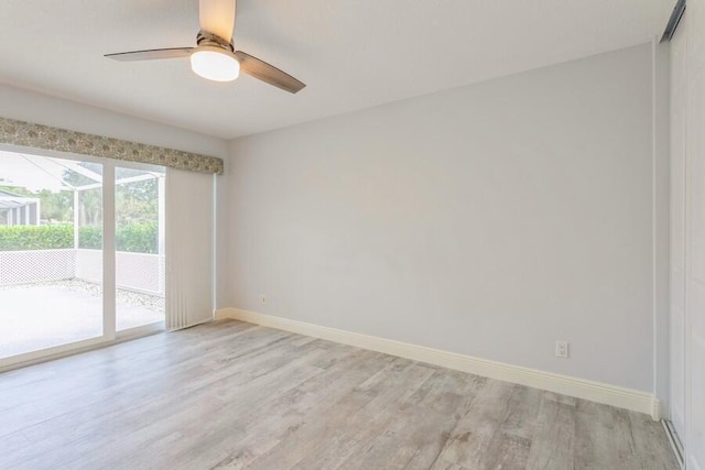 unfurnished room featuring light wood-type flooring and ceiling fan