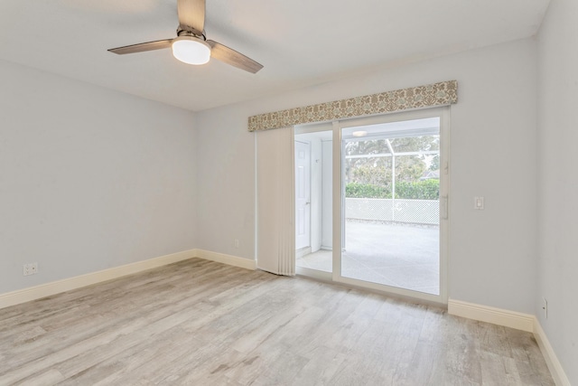 empty room featuring light wood-style floors, ceiling fan, and baseboards