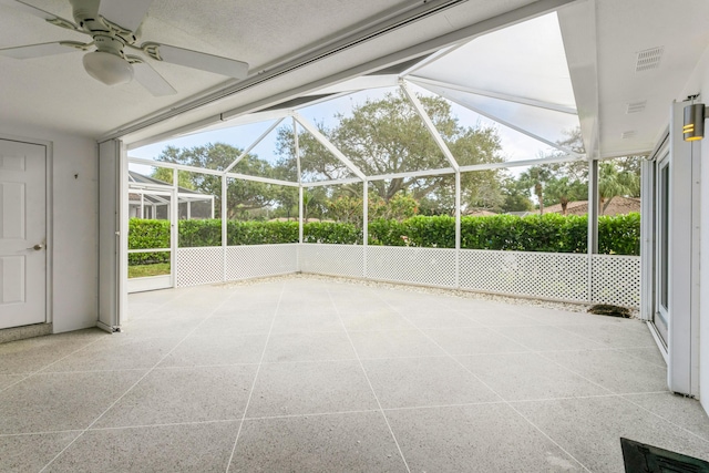 unfurnished sunroom with ceiling fan and visible vents