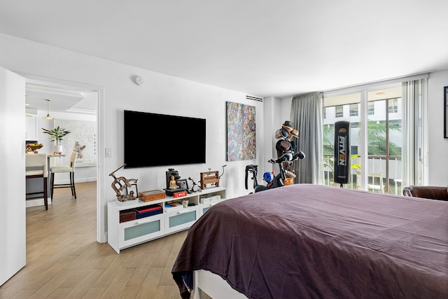 bedroom with light hardwood / wood-style floors