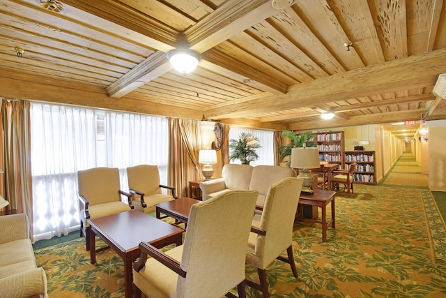 interior space with beamed ceiling, wooden ceiling, and dark carpet