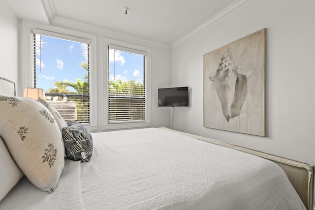 carpeted bedroom featuring ornamental molding