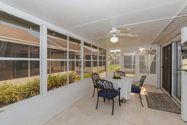 sunroom / solarium featuring ceiling fan