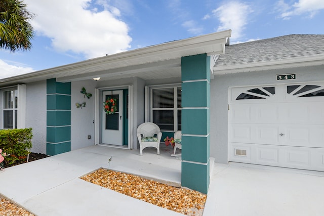 doorway to property featuring a garage