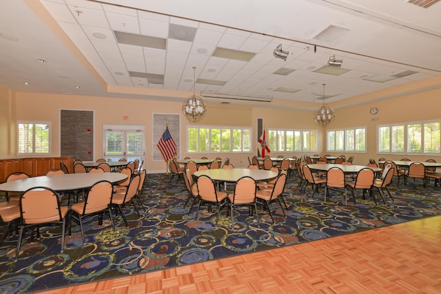 dining space with a healthy amount of sunlight and parquet flooring