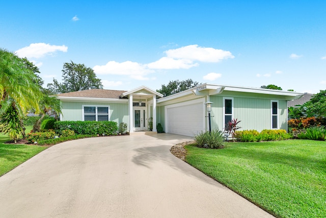 ranch-style house with a front yard and a garage