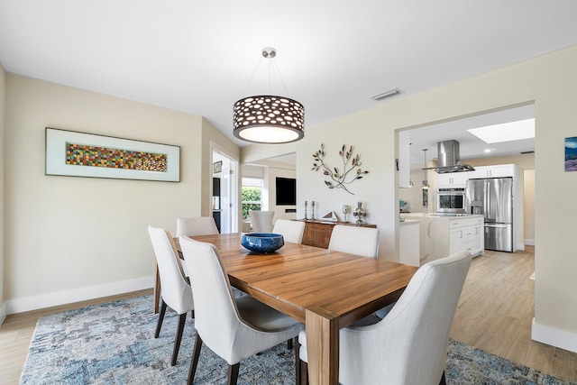 dining room featuring light wood-type flooring