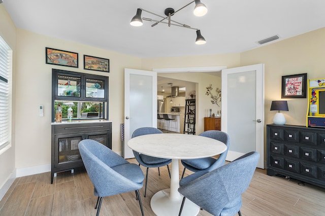 dining space featuring light hardwood / wood-style floors