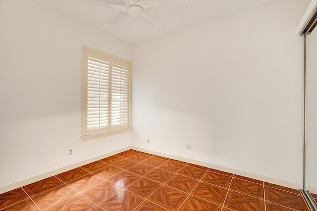 unfurnished room with ceiling fan