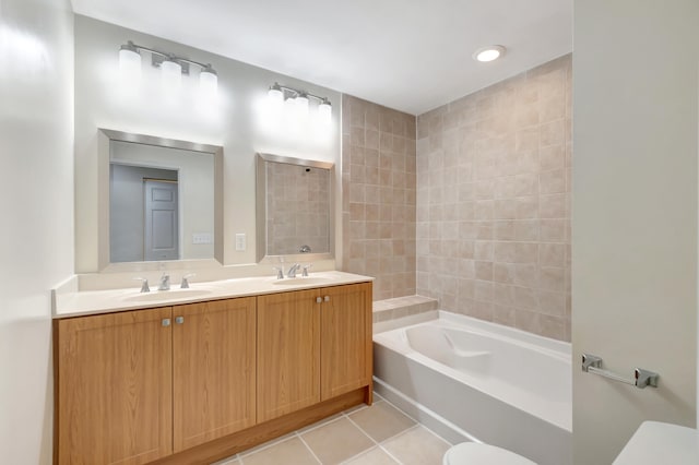 bathroom featuring vanity, toilet, and tile patterned flooring