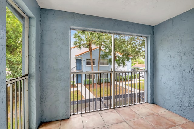 doorway featuring light tile patterned floors