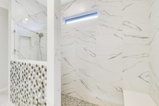 bathroom featuring tiled shower