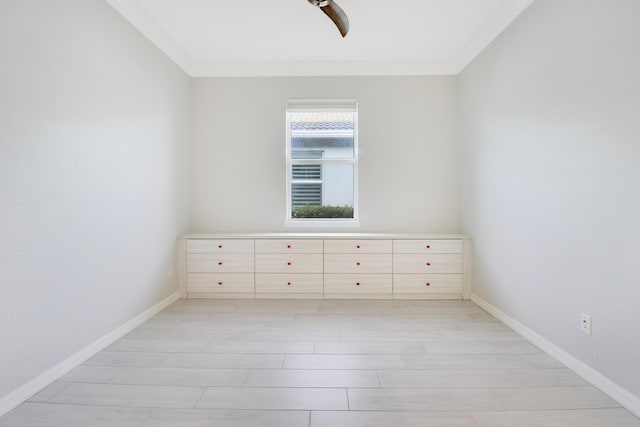 empty room featuring ornamental molding