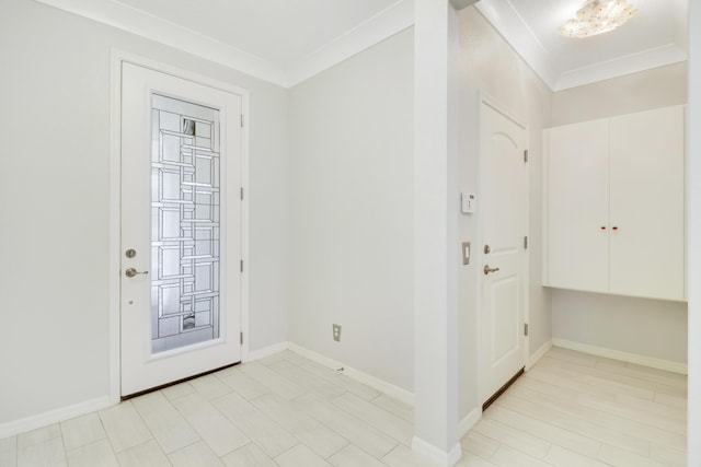 foyer entrance featuring crown molding