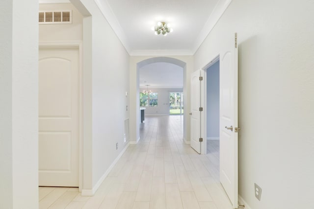 hallway featuring crown molding