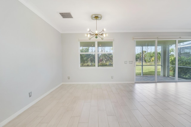 empty room with ornamental molding, light wood-type flooring, and a notable chandelier