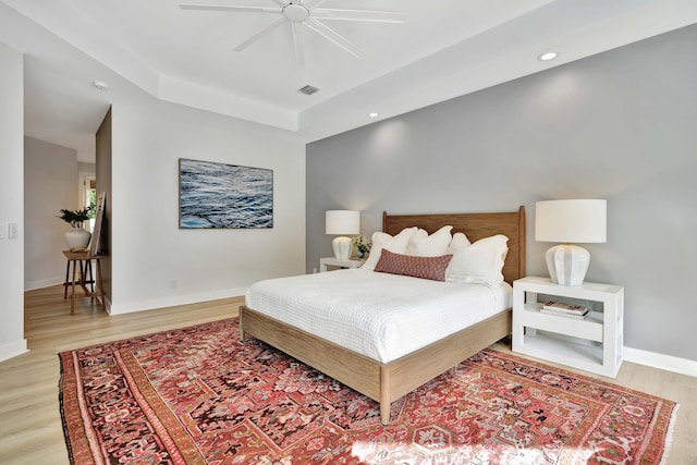 bedroom featuring light hardwood / wood-style floors and ceiling fan