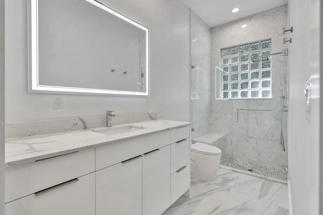 bathroom featuring a shower with door, vanity, and toilet