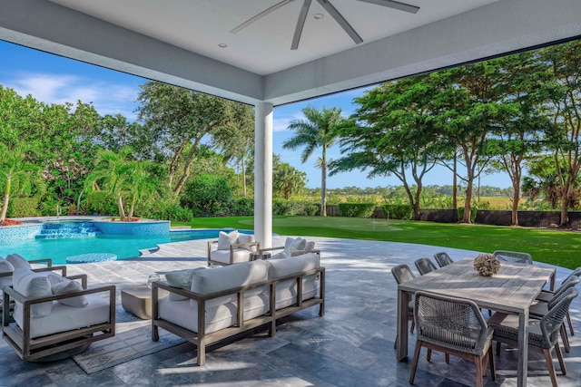 view of pool featuring a patio area, a yard, an outdoor hangout area, and ceiling fan