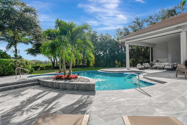 view of swimming pool featuring a patio, ceiling fan, and outdoor lounge area