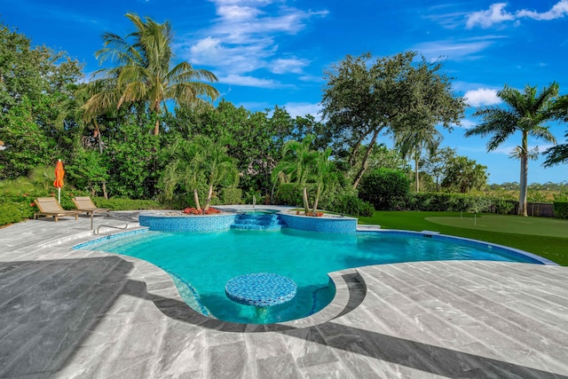 view of swimming pool featuring a patio area and a jacuzzi