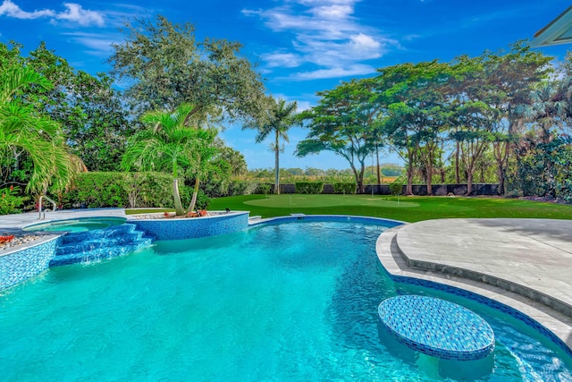 view of swimming pool with a yard and a patio area