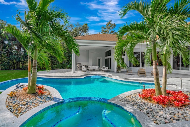 view of swimming pool with a patio, french doors, and an in ground hot tub