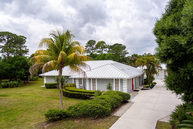 single story home with a front lawn and a garage