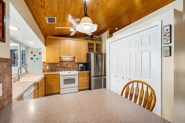 kitchen featuring hanging light fixtures, wooden ceiling, stainless steel fridge, sink, and white stove