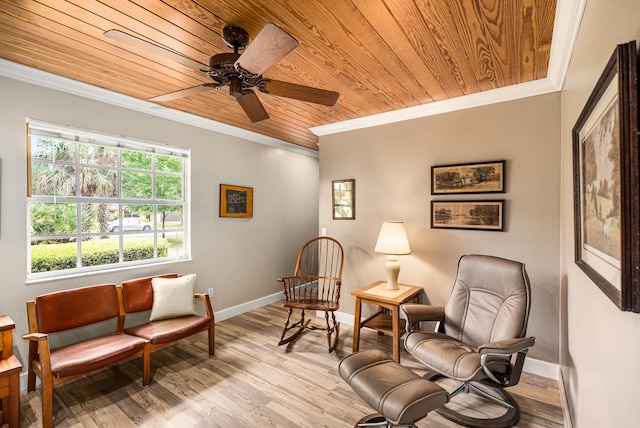 living area featuring light hardwood / wood-style floors, ornamental molding, wooden ceiling, and ceiling fan