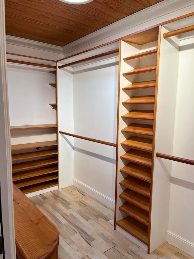 spacious closet featuring hardwood / wood-style floors