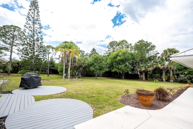 view of yard with a wooden deck