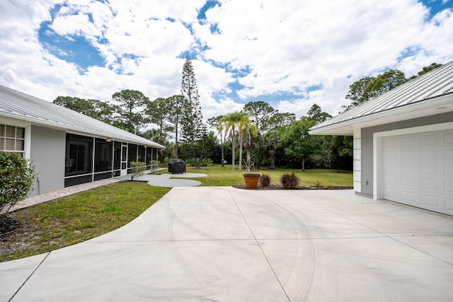 view of yard featuring a sunroom