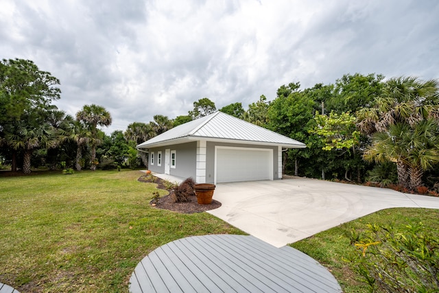 exterior space featuring a yard and a garage