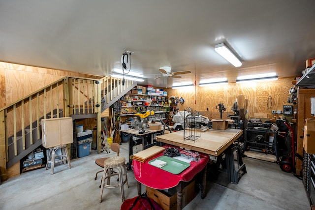 garage featuring ceiling fan and a workshop area