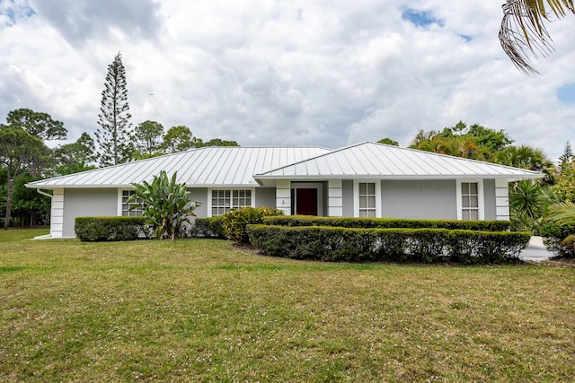 ranch-style home with a front lawn