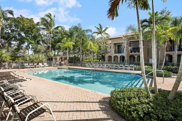 view of swimming pool with a patio