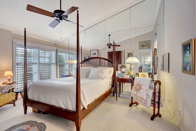 carpeted bedroom with ceiling fan, a textured ceiling, and lofted ceiling