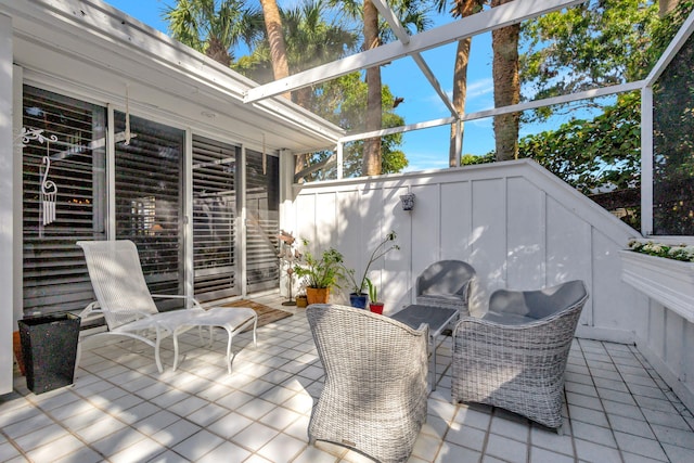 view of patio / terrace featuring a sunroom