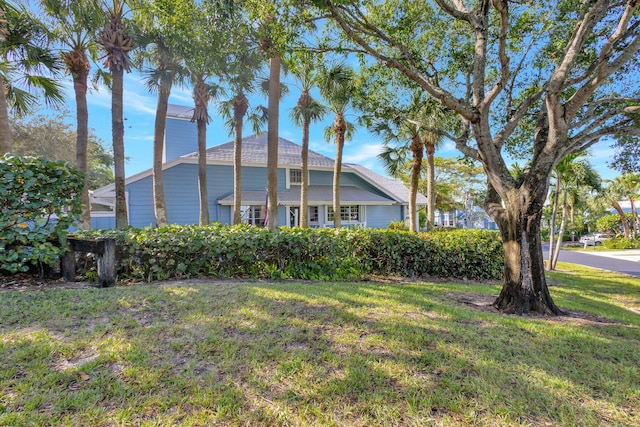 view of side of home featuring a yard