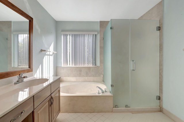 bathroom with tile patterned flooring, vanity, and separate shower and tub