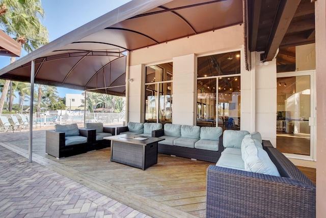 view of patio / terrace featuring an outdoor living space and a wooden deck