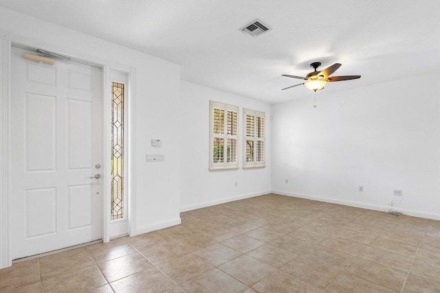 tiled foyer entrance with ceiling fan