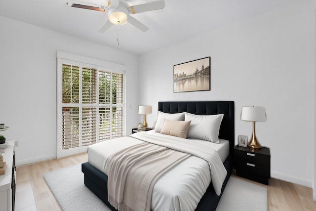 bedroom with ceiling fan and light hardwood / wood-style floors