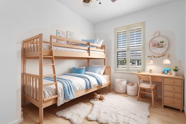 bedroom with ceiling fan, light hardwood / wood-style floors, and lofted ceiling