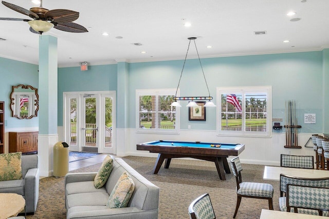 game room featuring pool table, carpet, crown molding, and a wealth of natural light