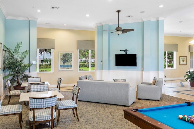 carpeted living room with crown molding, ceiling fan, and billiards