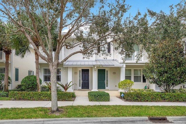 view of front of property with a balcony