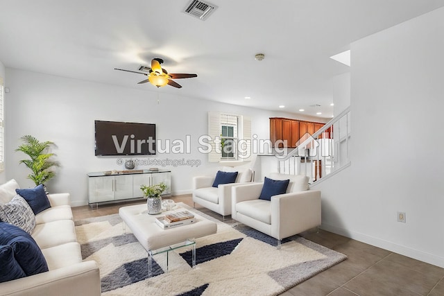 living room featuring tile patterned floors and ceiling fan