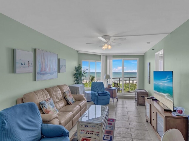 tiled living room featuring ceiling fan